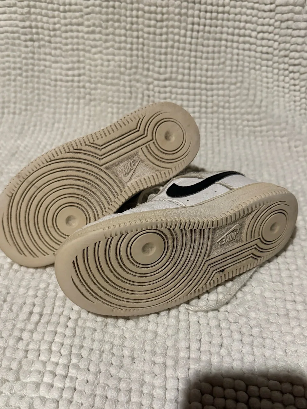 Nike Kids White Sneakers with Black Swoosh